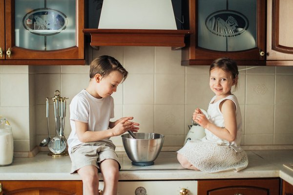 What are the safety considerations when designing a kitchen with young children?