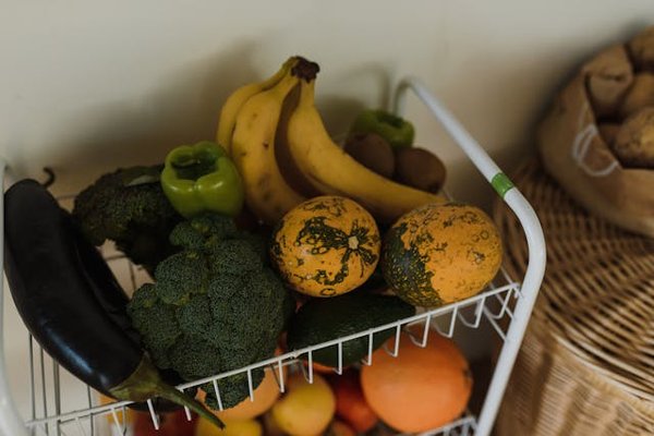 What is the best way to store fruits and vegetables in the kitchen to promote their use in slimming recipes?